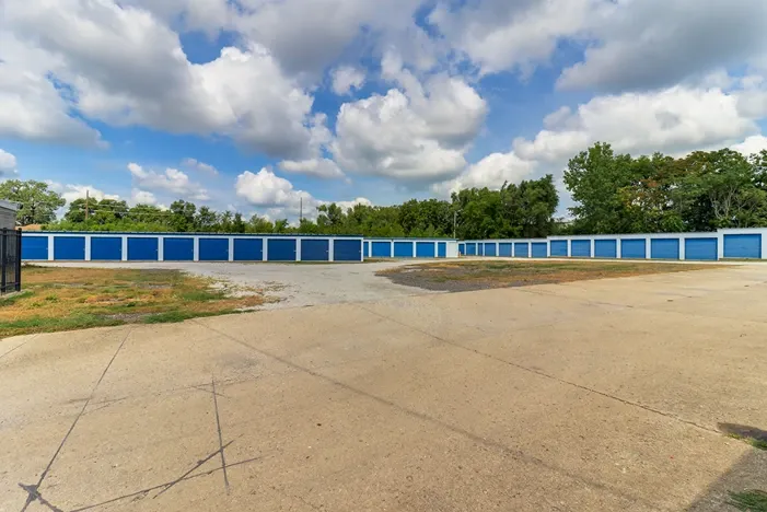 Paved road with gated fence.