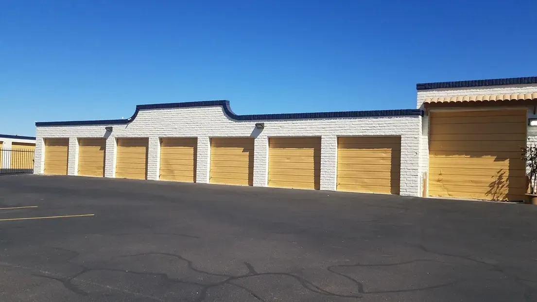yellow drive up storage units with open driveway