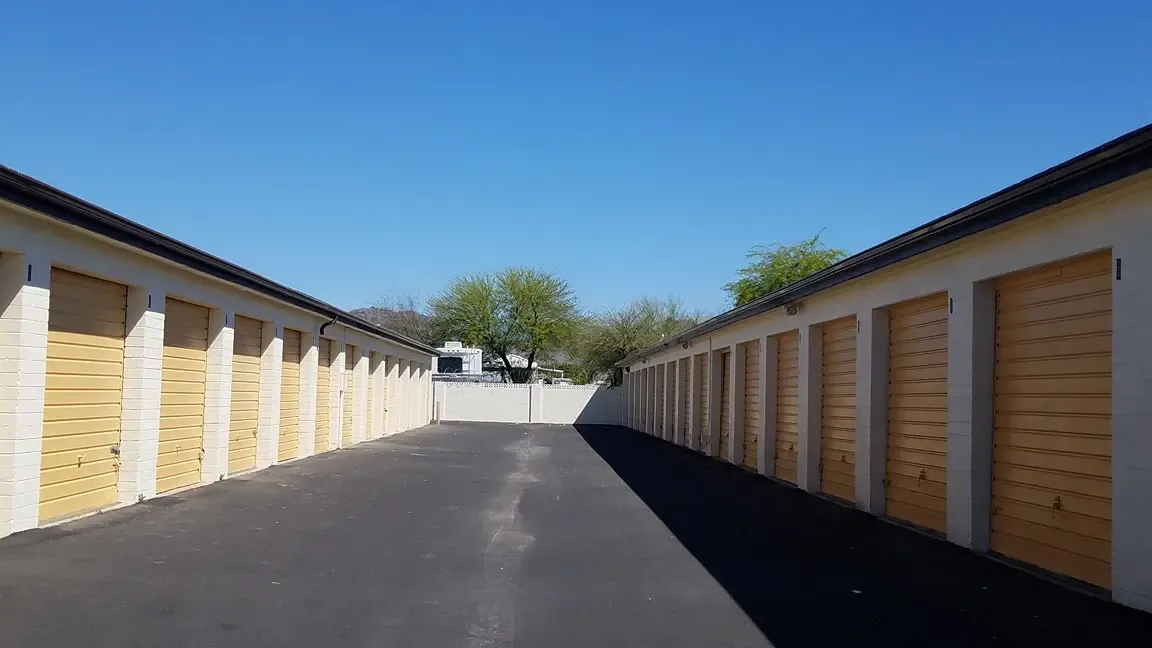yellow drive up storage units with an open driveway