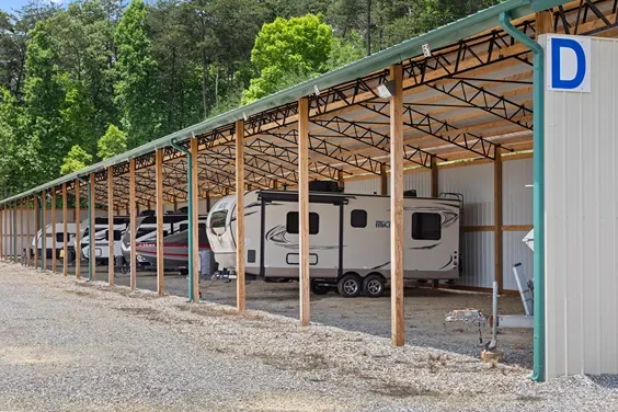 Covered gravel parking spaces.
