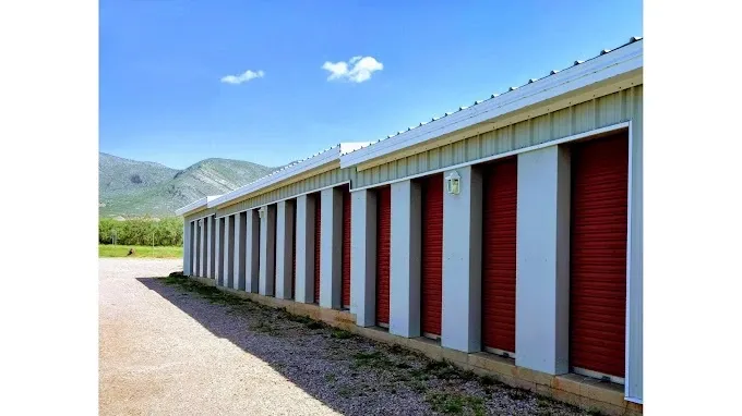 drive up mini storage units with a gravel driveway.