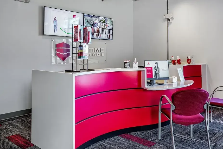 Chair in front of a red painted cabinet