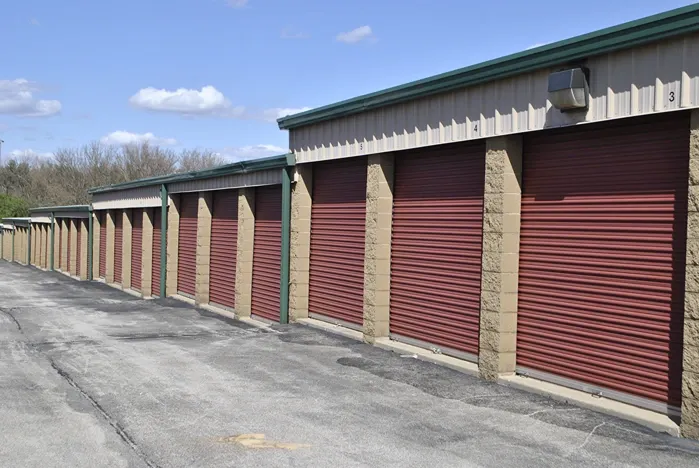 Outdoor storage with trees in the background.