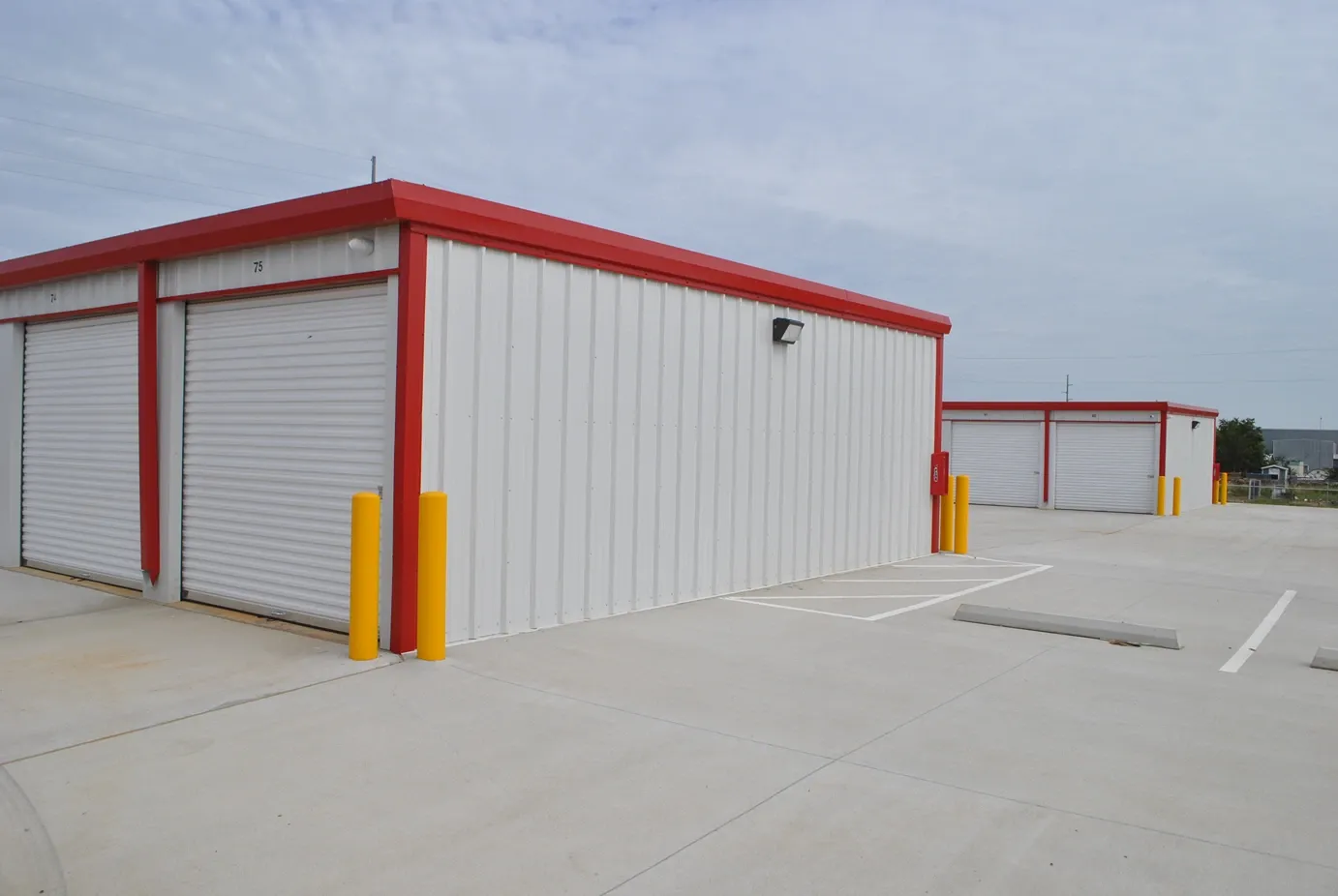 Outdoor storage with parking spaces.