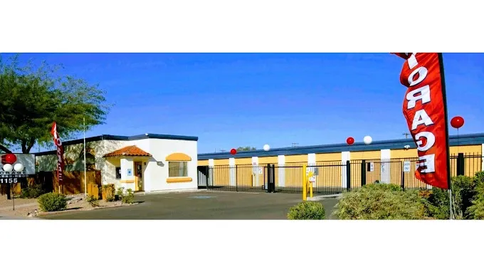 entrance to a storage facility with two gates and a secure keypad.