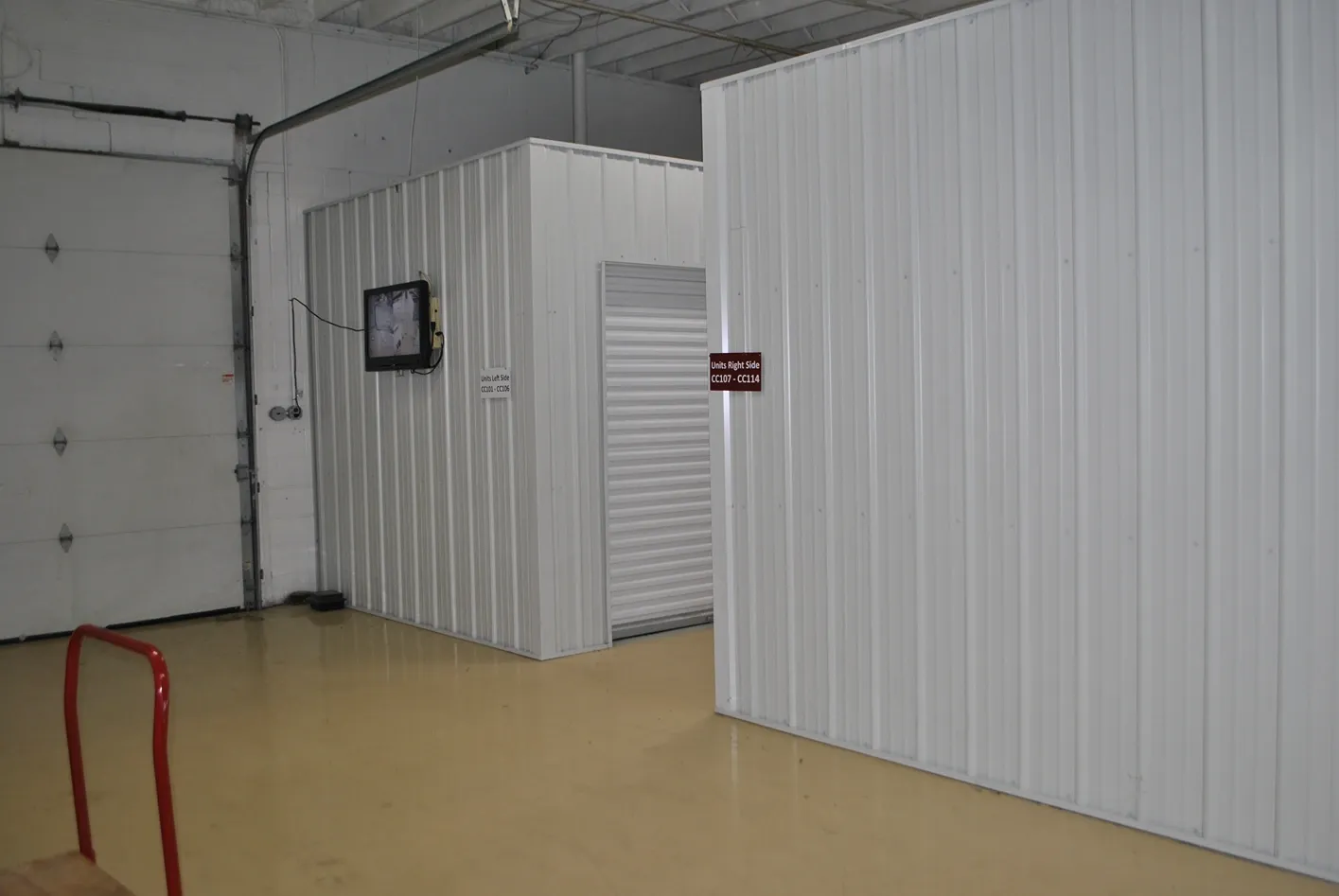 Hallway view of indoor storage units.