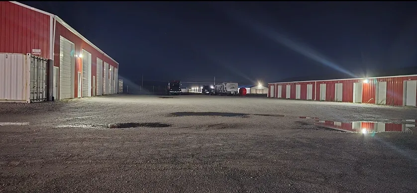 Well lit outdoor storage at night time.