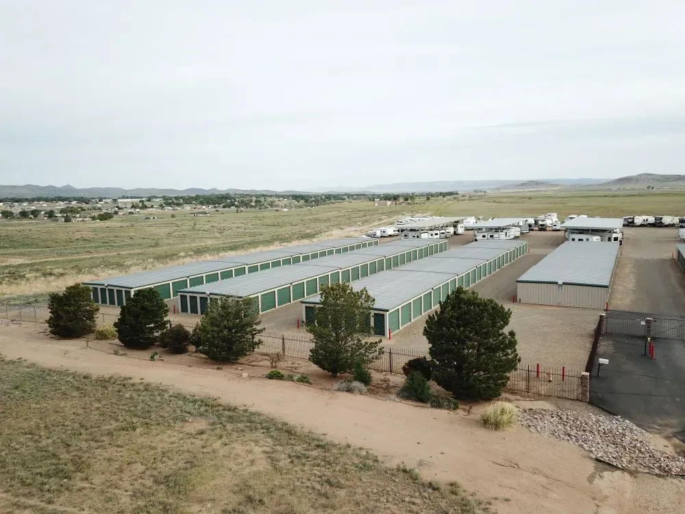 view overlooking storage facility with drive up units and covered vehicle parking