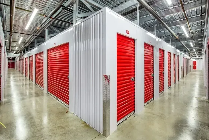 Corner interior hallway with red storage doors